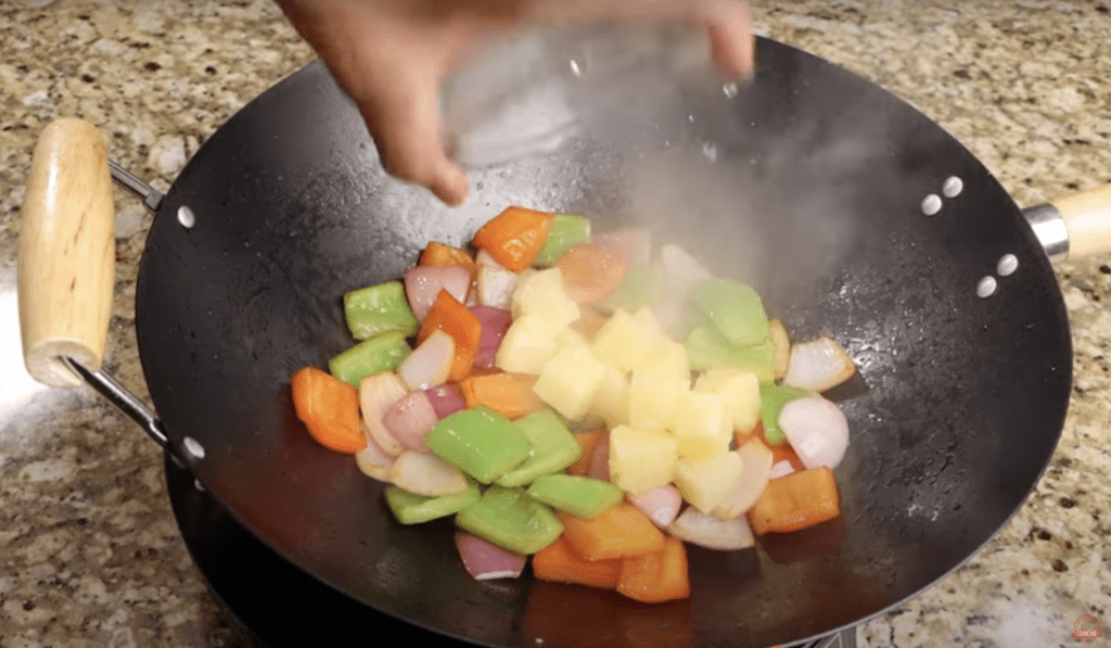 Saute bell pepper, pineapple and onion  for Sweet and Sour Chicken