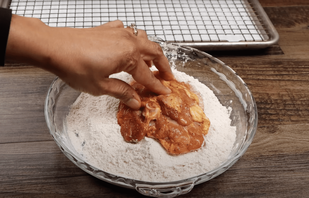 coating chicken with flour