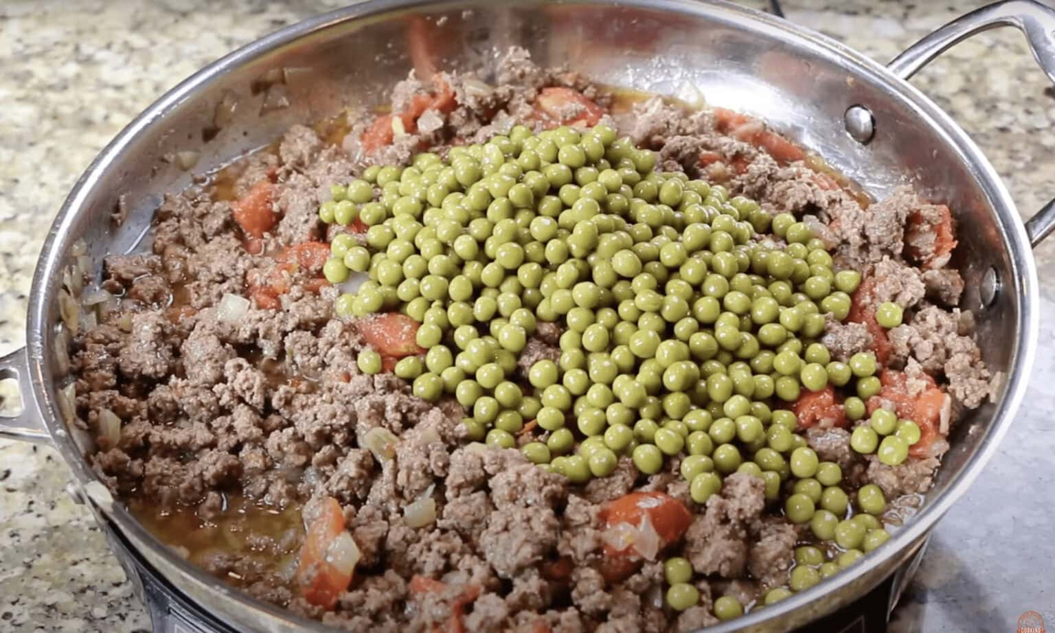 ground beef, stewed tomatoes, peas,  
Tamale pie