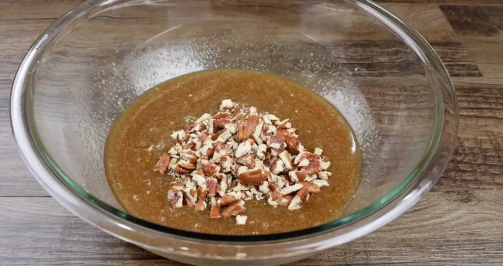 adding the chopped pecans to filling