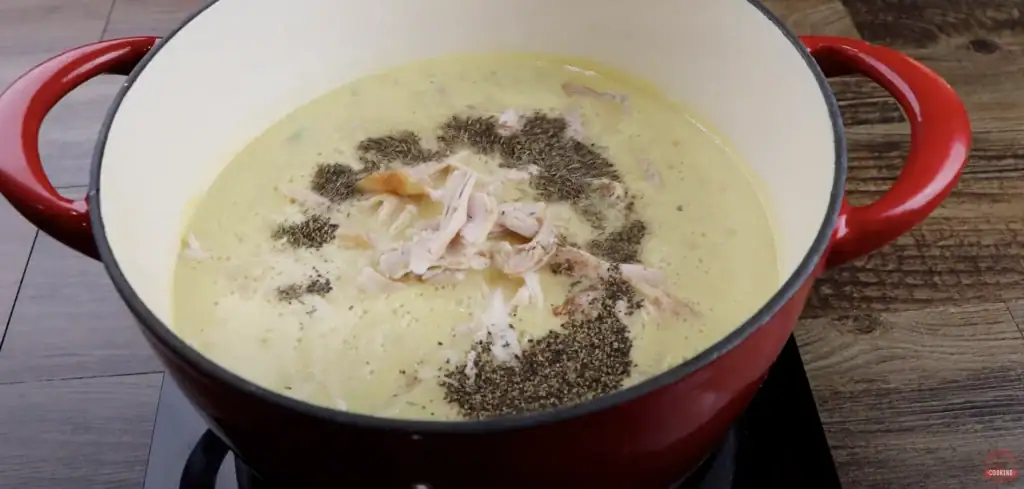 Adding chicken to chicken and dumplings