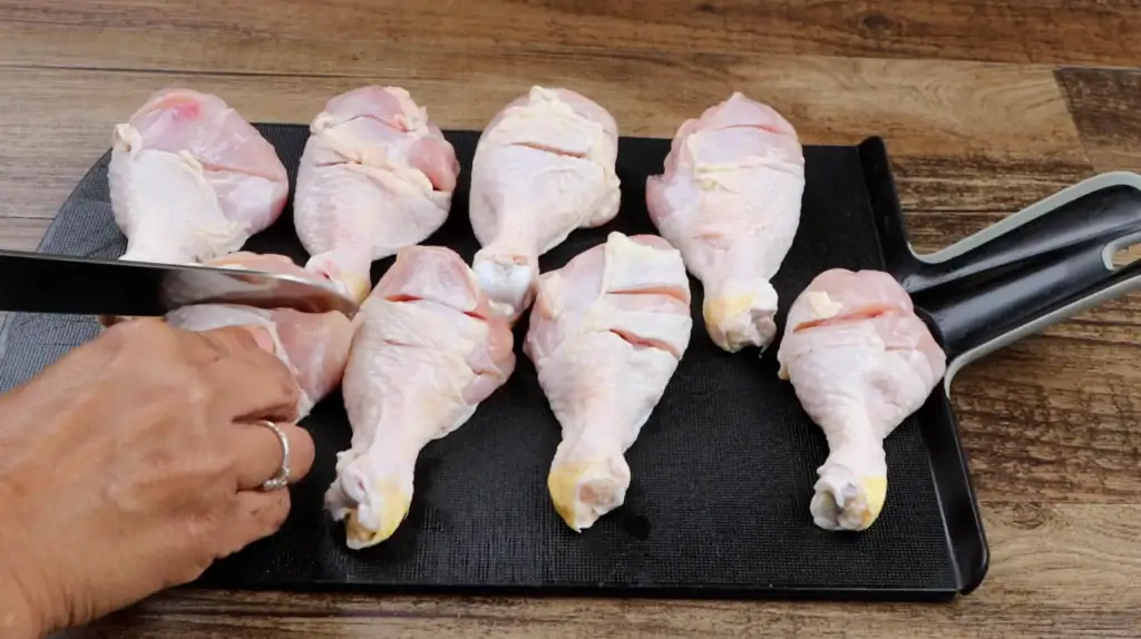 Scoring the Chicken Legs for Baked Chicken