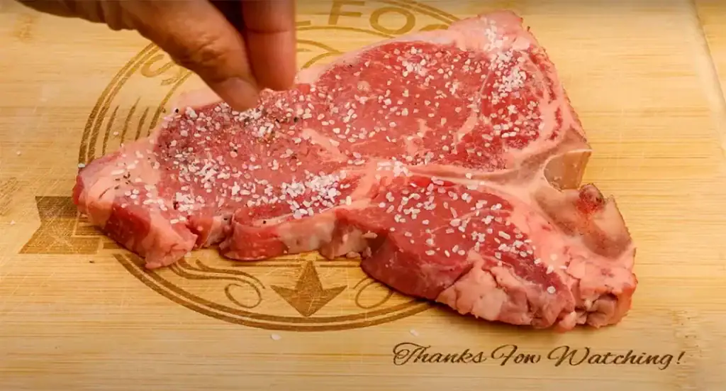 Seasoning the Porterhouse Steak