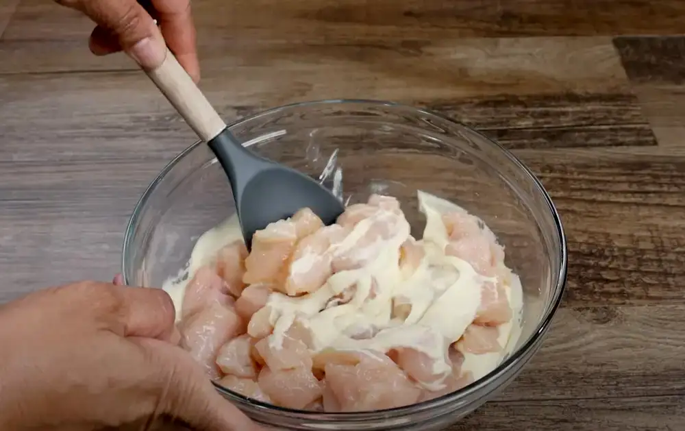 Coating the Chicken for Crispy Honey Chicken