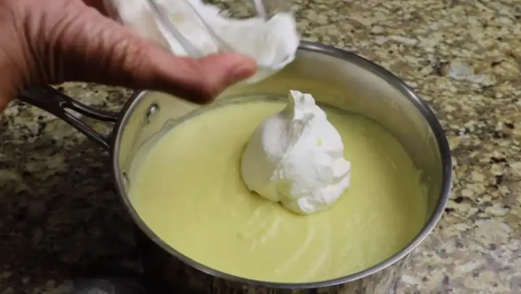 Adding Whipping Cream for Chessman Banana Pudding
