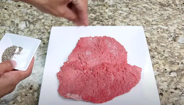 Seasoning the Cubed Steak