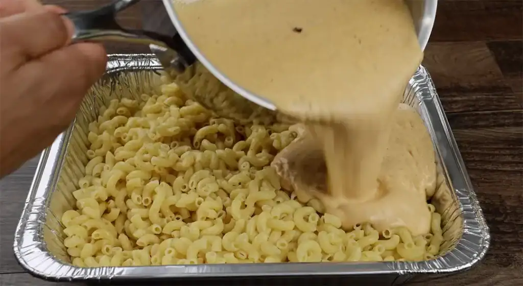 Coating the Macaroni for Mac and Cheese