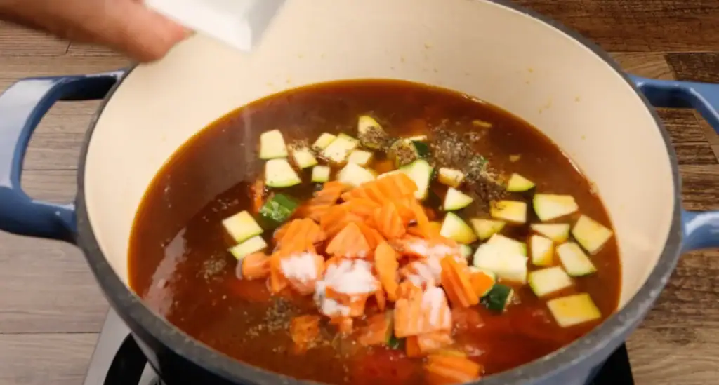 Adding the veggies to the Italian Sausage Soup