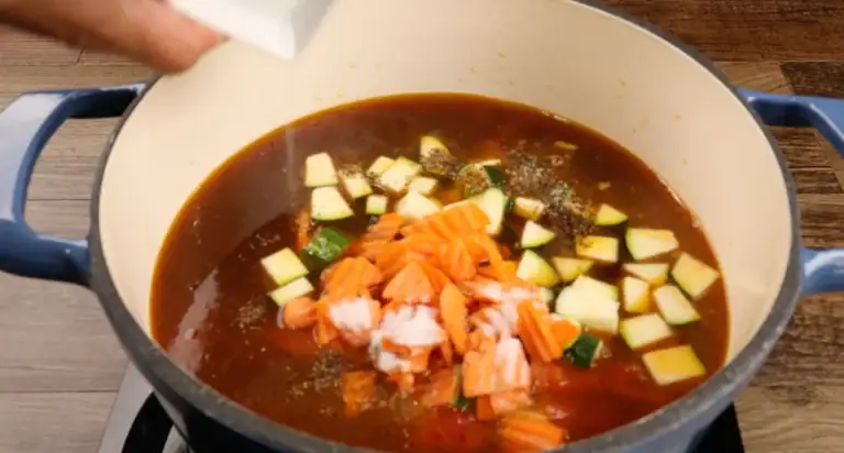 Adding the veggies to the Italian Sausage Soup
