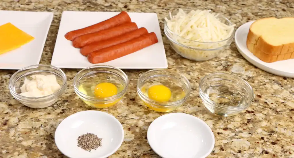 Ingredients for breakfast sandwich which includes eggs, hash browns, cheese and sausage