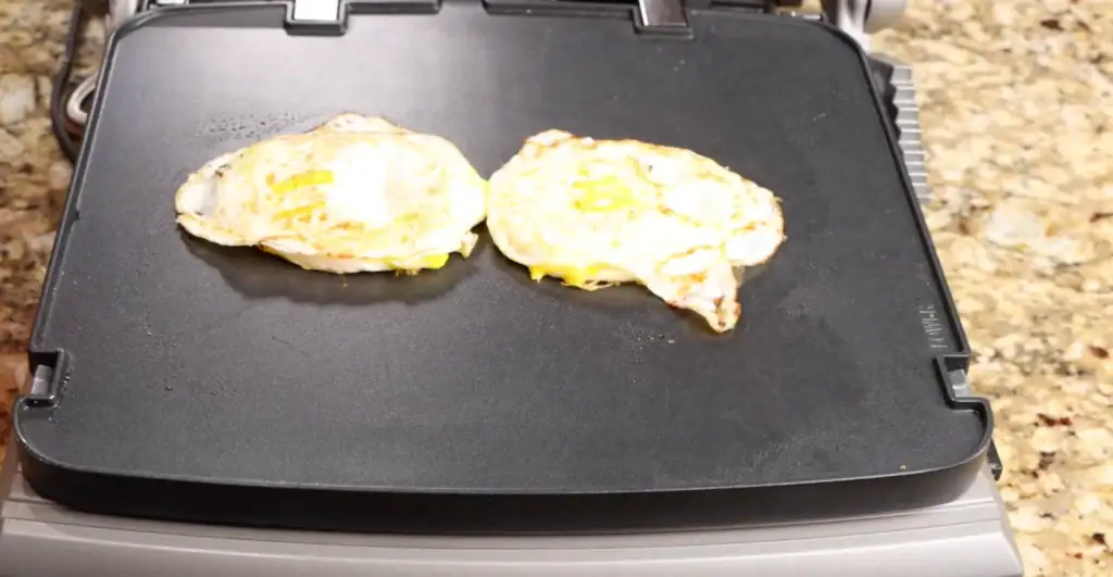 Making the eggs for breakfast sandwich
