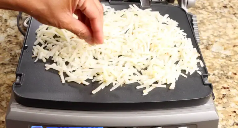 Making the hash browns for breakfast sandwich