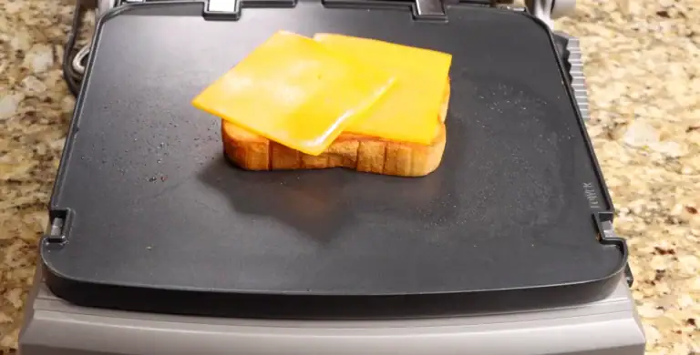 melting the cheese for the breakfast sandwich