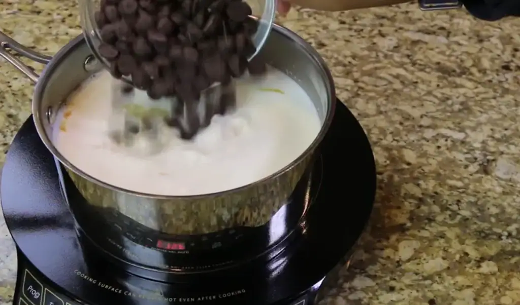 adding bittersweet chips to Homemade Hot chocolate