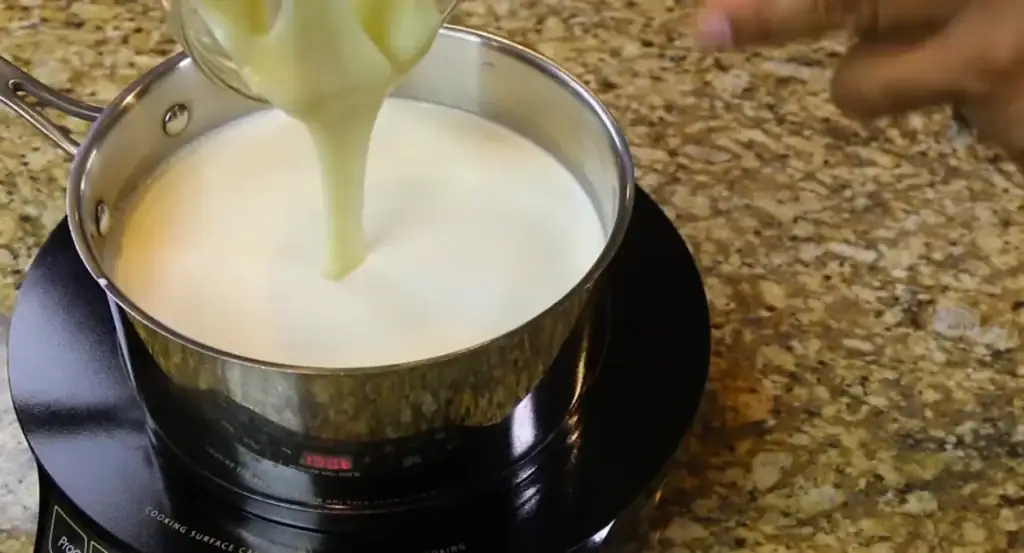 Adding Sweeten Condensed Milk to Warming Milk for Homemade Hot Chocolate