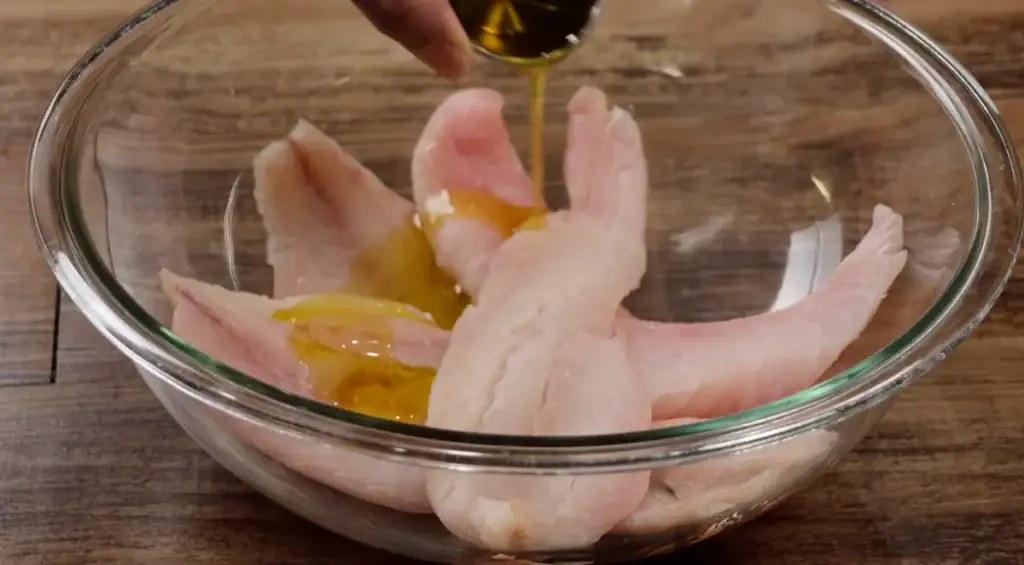 Drizzling Olive Oil over Rockfish