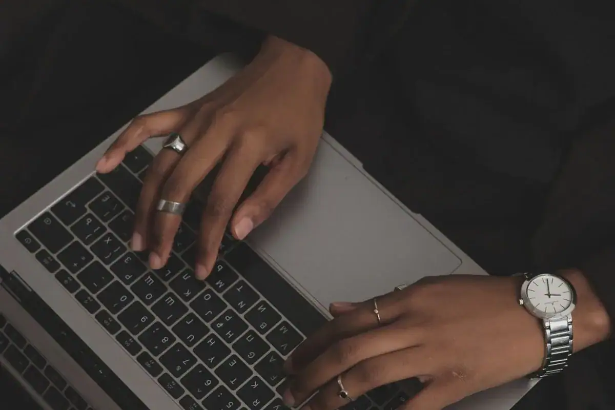 black woman typing on a computer