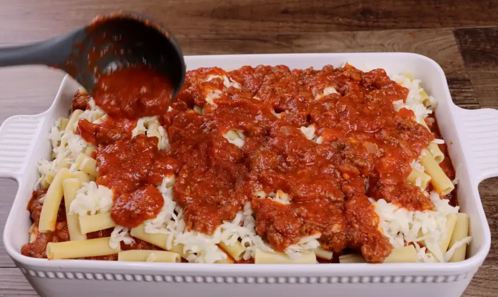 Adding a layer of Sauce for Baked Ziti
