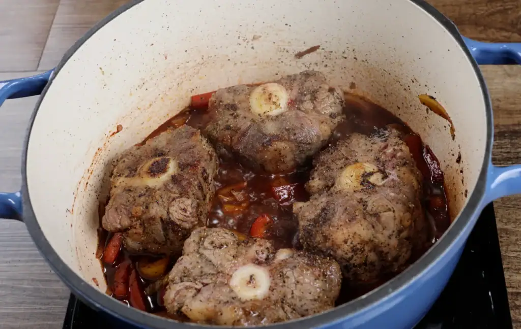 Returning the Oxtails back to Dutch oven