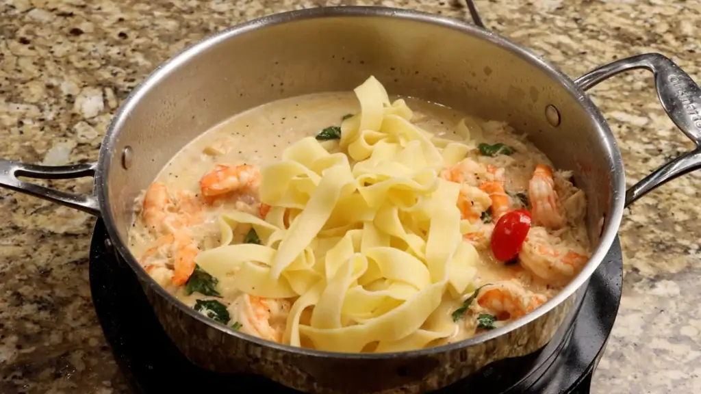 Adding the Pasta to the Sauce for Seafood Pasta
