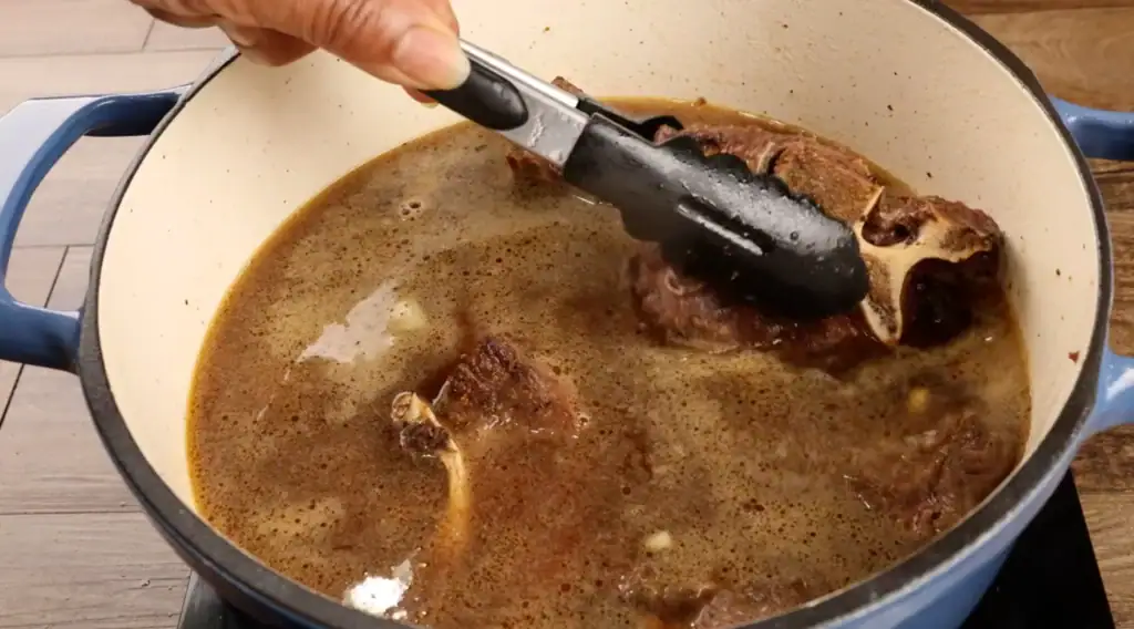 Returning Beef Neck Bones to the Pot