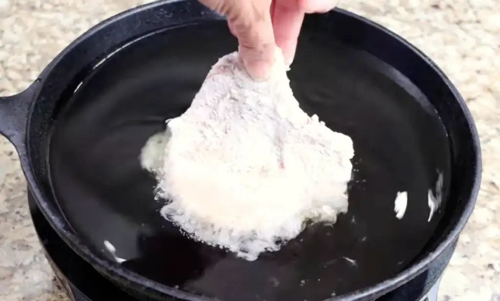 Frying the Pork Chop in a cast iron skillet