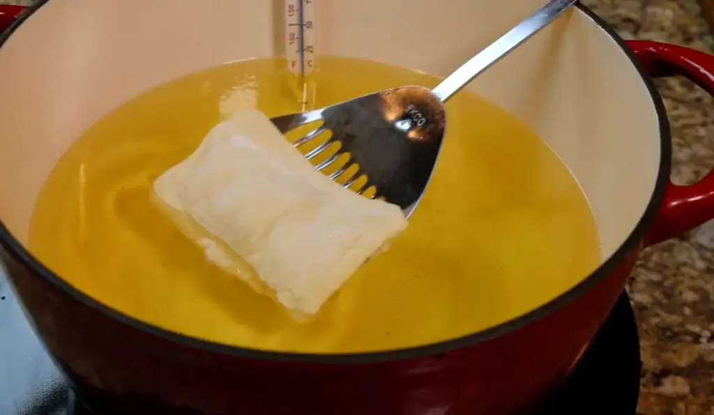 Adding Pie to Oil for Fried Apple Pie