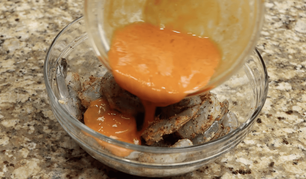 Coating the Shrimp with the Wet Ingredients for Cajun Shrimp