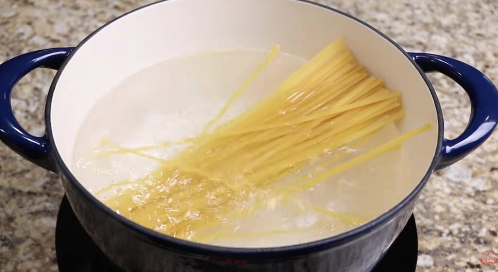 Fettuccine pasta in a large pot of water