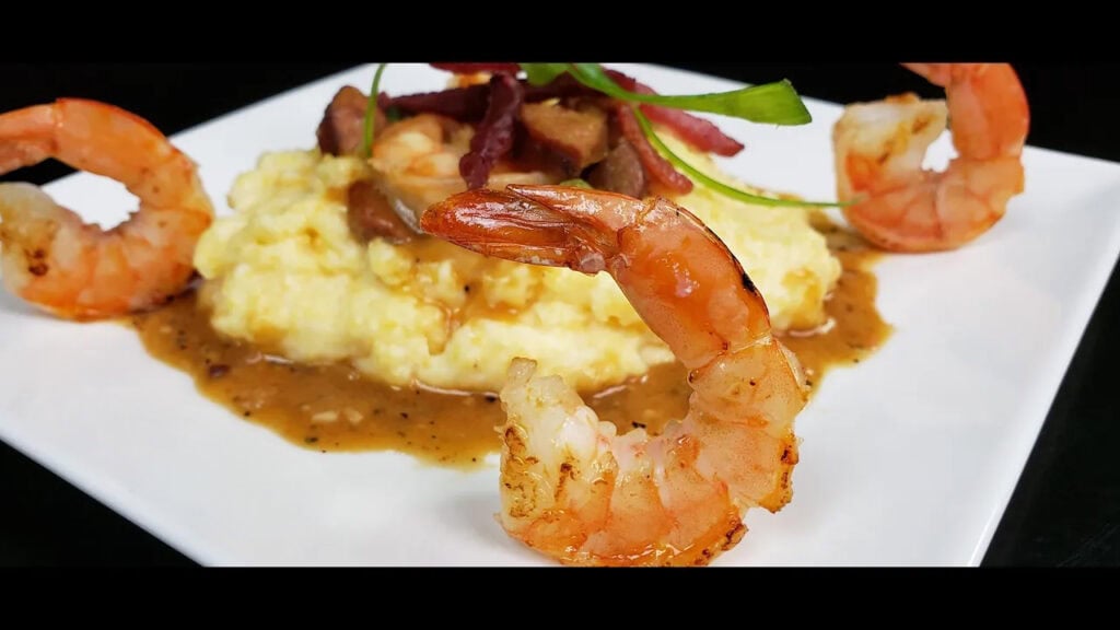 shrimp and grits on a white plate
