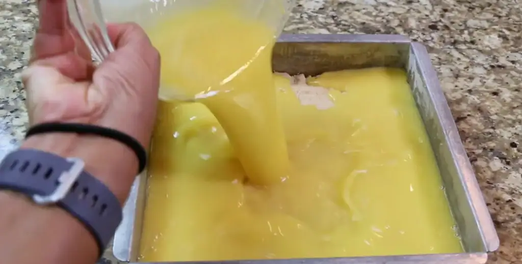 lemon-bars-pouring-filling-over-crust