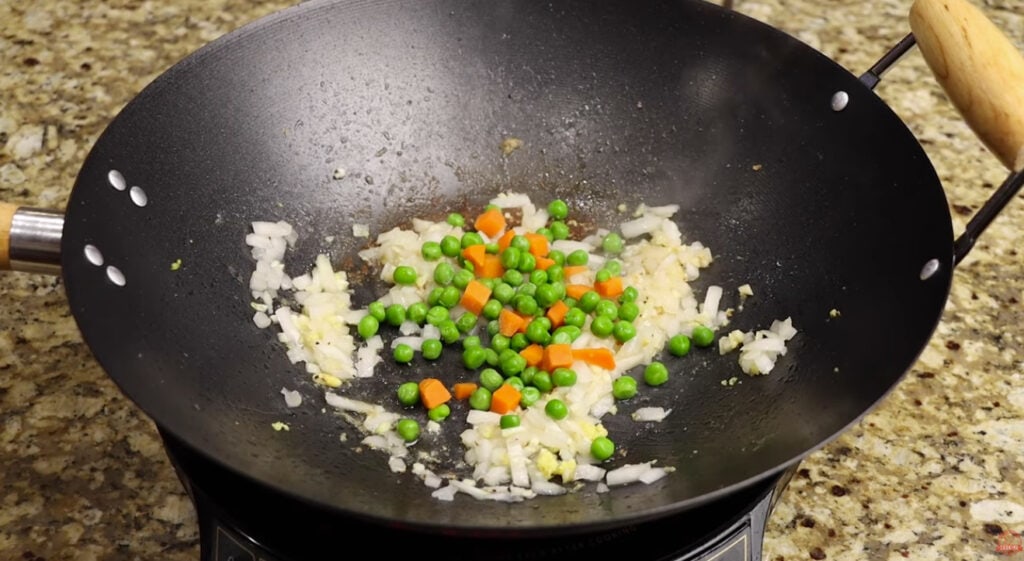 Adding the Peas and Carrots for Shrimp Fried Rice