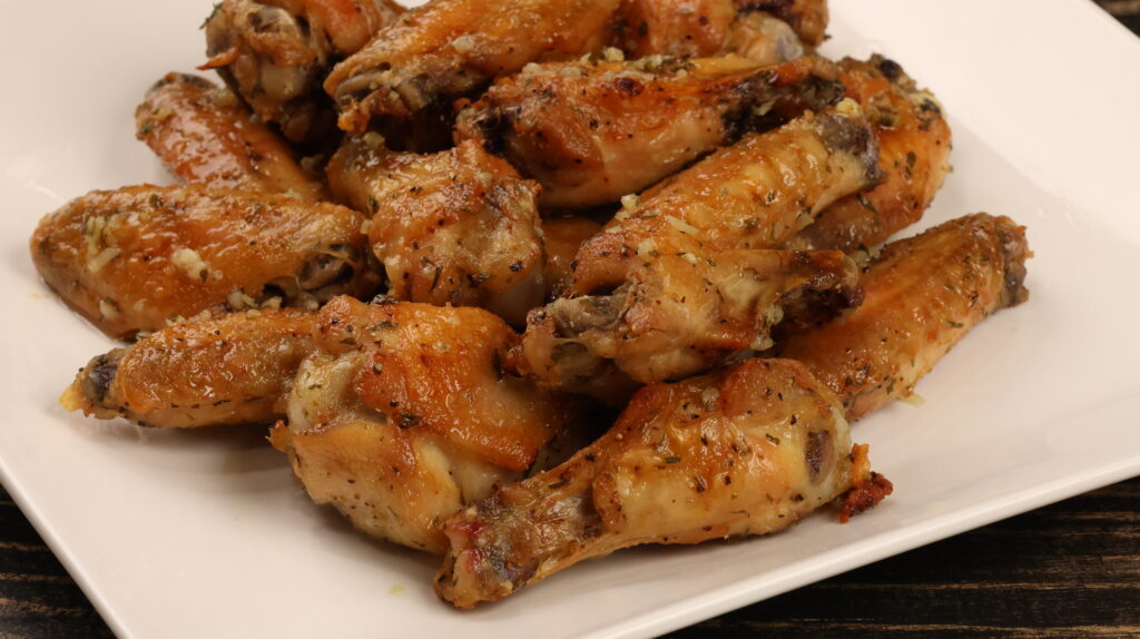 Butter Garlic Wings on a white plate
