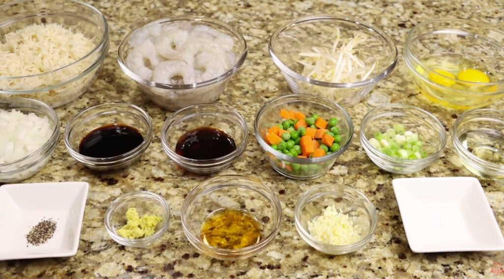 Ingredients for Shrimp Fried Rice including shrimp, egg, bean sprouts, rice, peas and carrots, onion, garlic and soy sauce