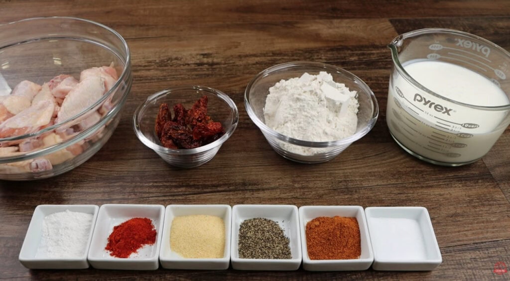 Ingredients for Ghost Pepper Wings including ghost peppers, salt, black pepper, paprika, butter milk, flour, wings and canola oil