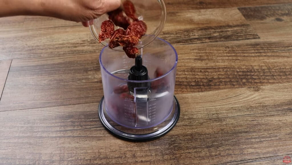 Ghost peppers freshly ground into fine powder inside a Ninja chopper for Ghost Pepper Wings