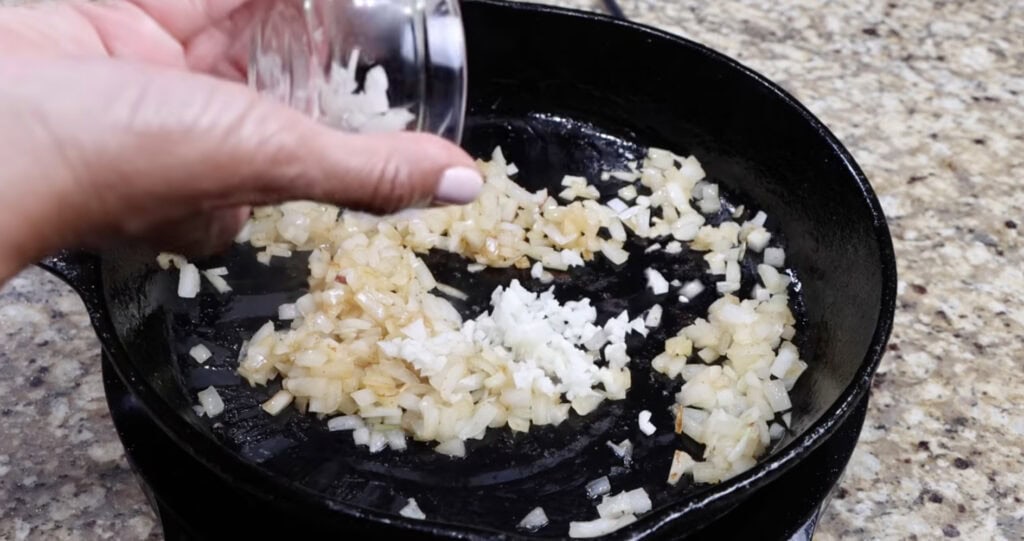 Adding the Garlic to Pan for Baked Beans