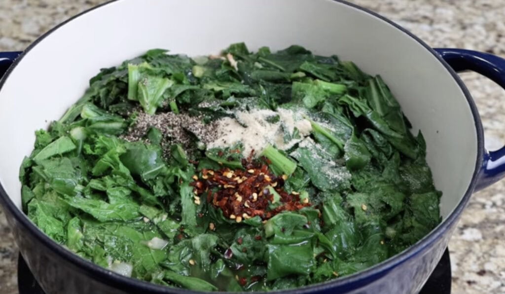 Adding the Seasoning to the Mix Greens