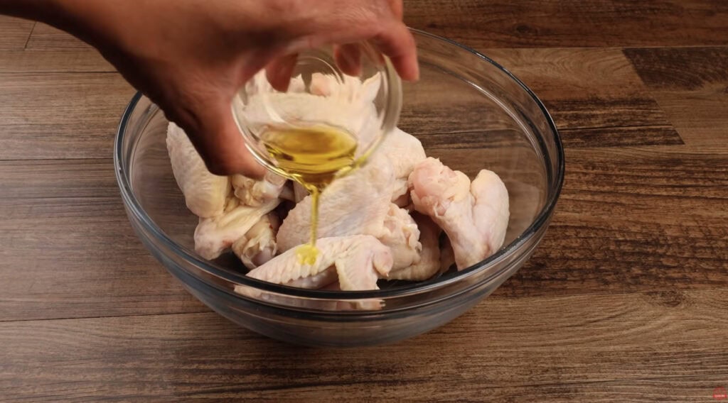 Coating Chicken Wings With Olive Oil