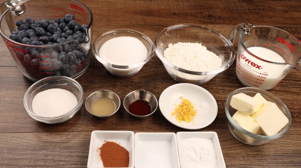 Ingredients for Blueberry Cobbler including blueberries, butter, all-purpose flour, sugar and milk